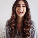 laughing-woman-bed