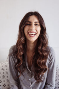 laughing-woman-bed