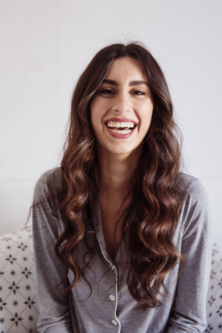 laughing-woman-bed