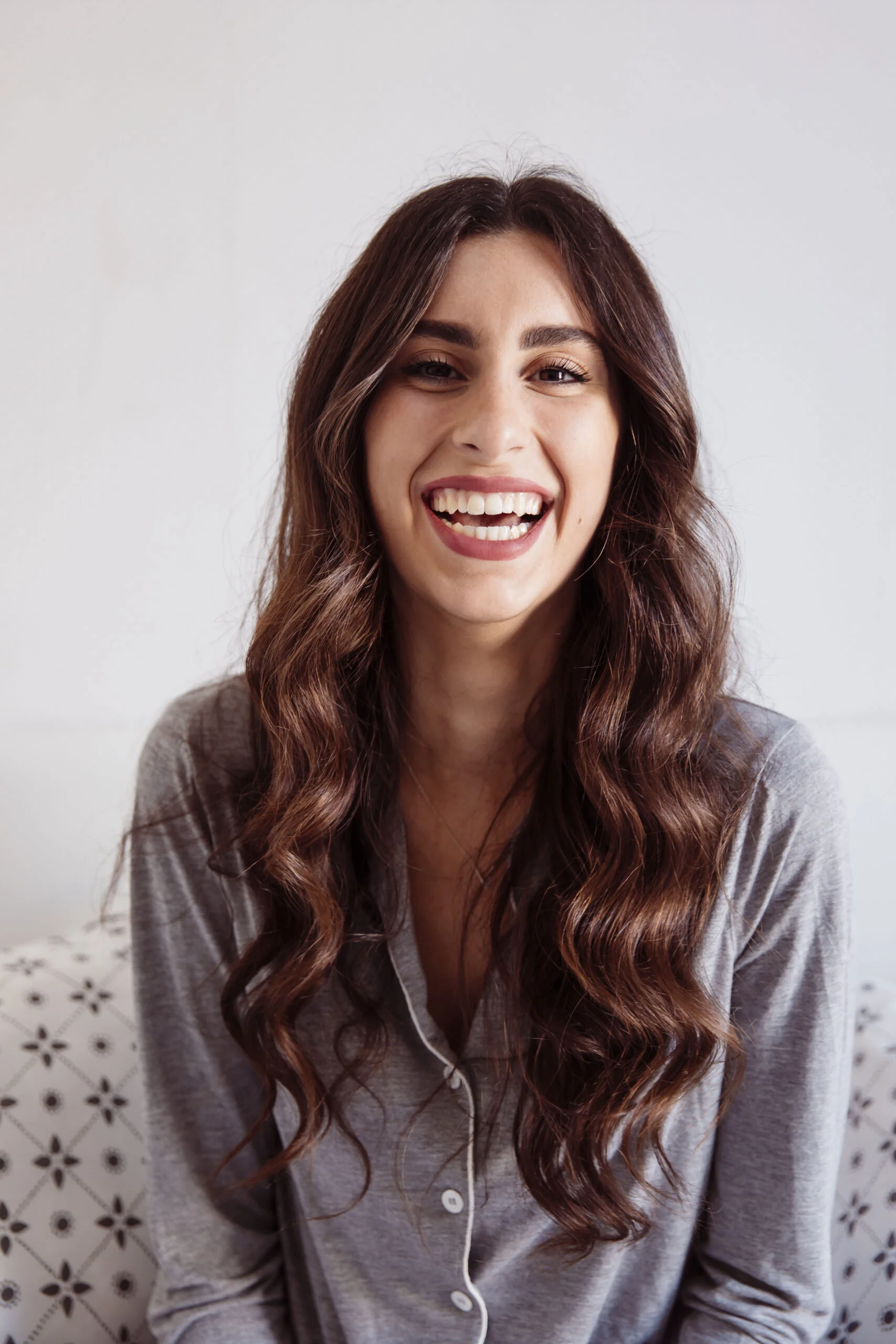laughing-woman-bed